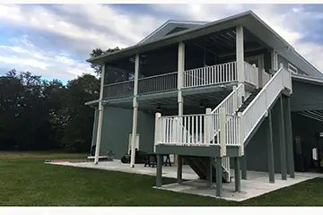Screen room under existing roof by East Coast Aluminum